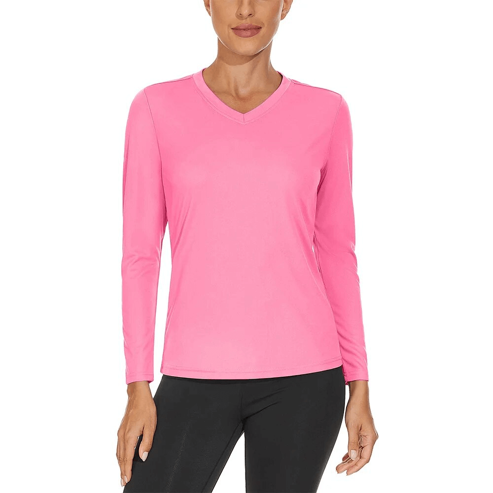 Woman wearing a pink, sun-protective, long-sleeve sports top with a V-neck, ideal for outdoor adventures. UPF 50+ and quick-drying material.